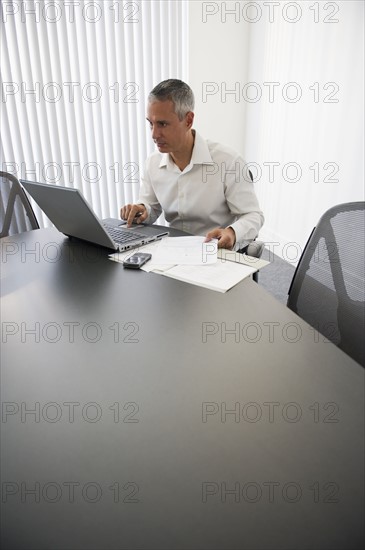 Businessman working at computer.