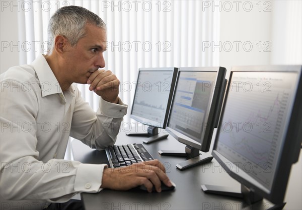 Businessman working at computer.