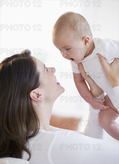 Mother playing with her baby.