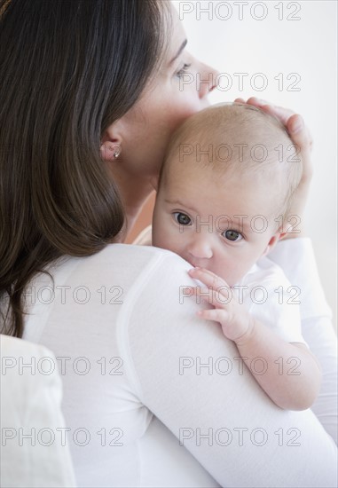 Mother holding her baby.