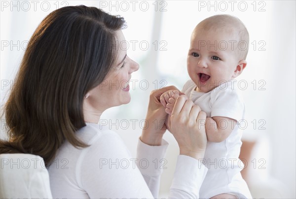 Mother holding her baby.