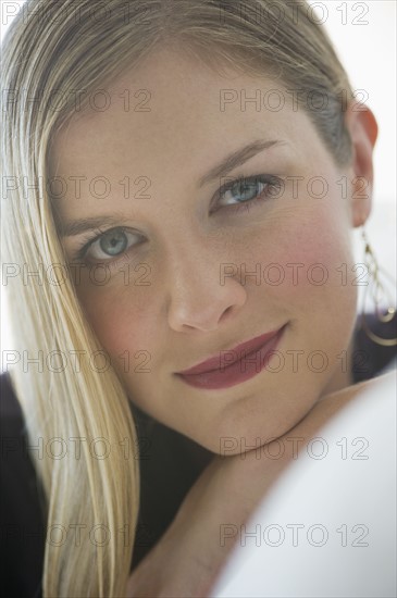 Sophisticated woman relaxing on couch.