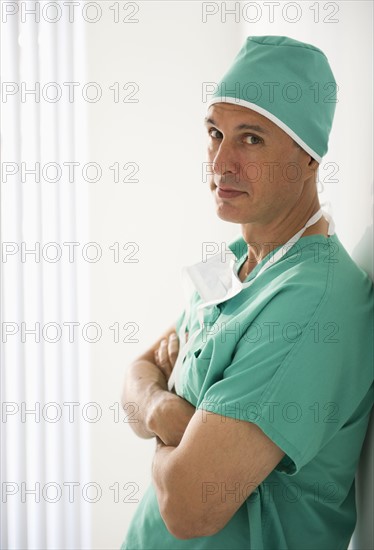 Surgeon wearing medical scrubs.