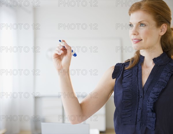 Businesswoman brainstorming. Photo : Jamie Grill