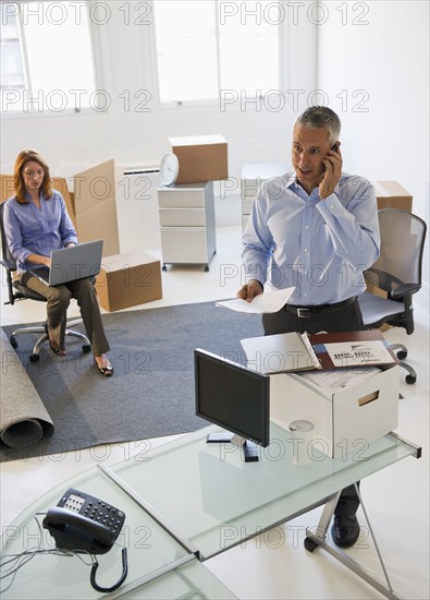 Business entrepreneurs working in startup office.