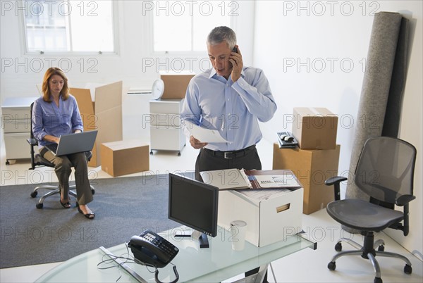 Business entrepreneurs working in startup office.