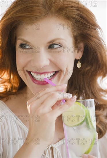 Woman drinking lime water. Photo : Jamie Grill