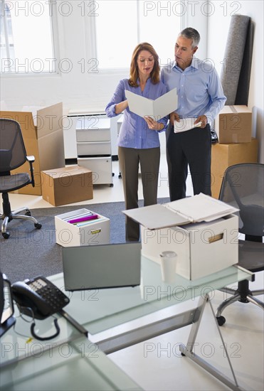 Business entrepreneurs working in startup office.