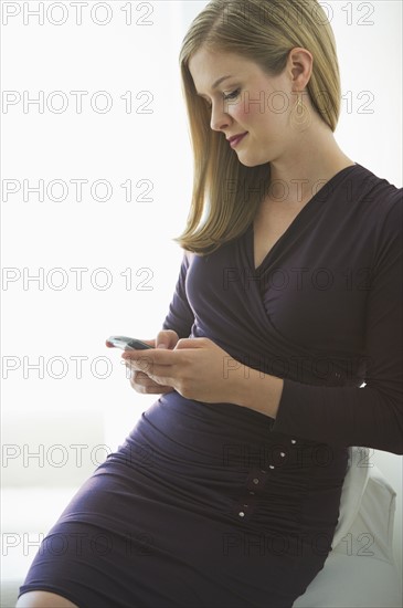 Sophisticated woman texting.