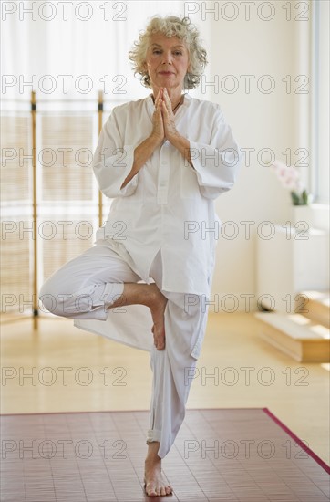 Woman doing yoga. Photo : Daniel Grill