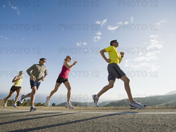 Runners on a road in Malibu.