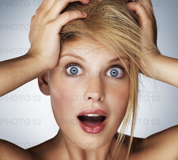 Shocked blond woman