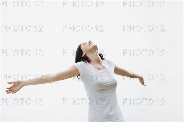 Carefree woman stretching. Photo. momentimages