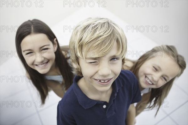 Three playful children. Photo. momentimages