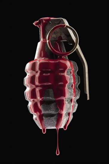 Red paint on grenade. Photo : Mike Kemp