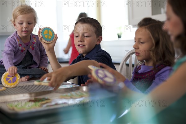 Children baking cookies. Photo. Tim Pannell