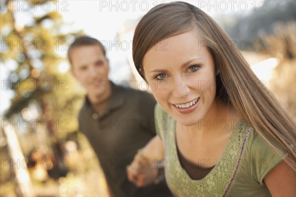 Woman pulling boyfriend by the hand. Photo. FBP