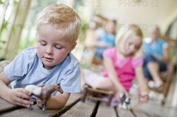 Children playing on porch. Photo. Tim Pannell