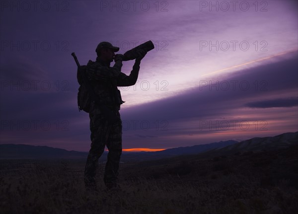 Big game hunter at dusk. Photo. Mike Kemp