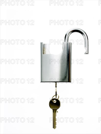 Key in padlock. Photo. David Arky