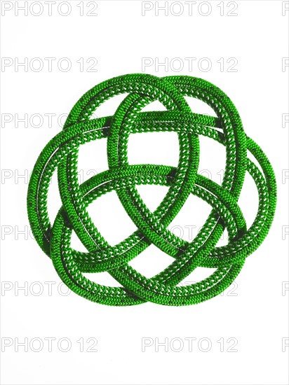 Green rope looped together. Photo. David Arky