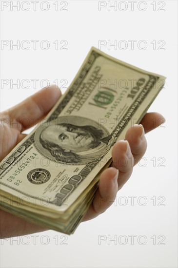 Hand holding money. Photo. Antonio M. Rosario
