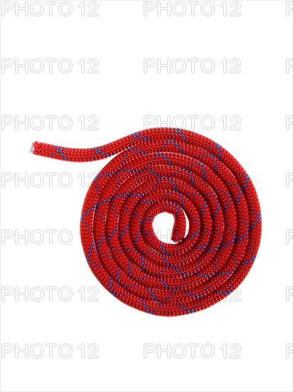 Red rope in a circular pattern. Photo. David Arky