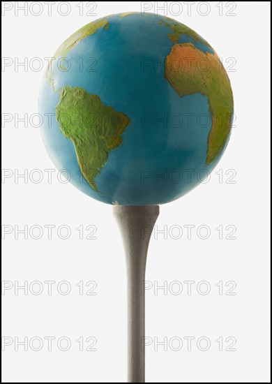 Globe on golf tee. Photo : Mike Kemp