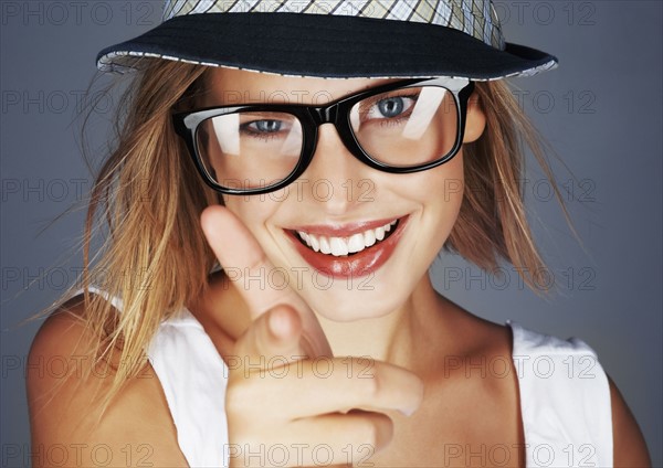 Blond woman wearing sunglasses and sunhat. Photo. momentimages