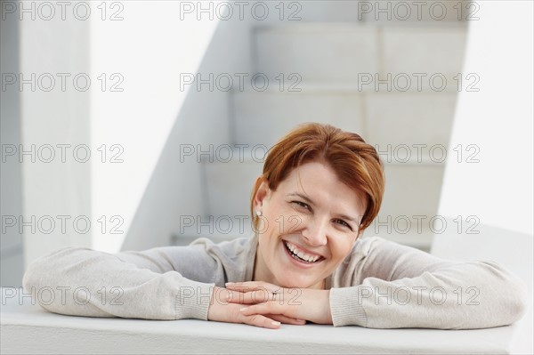 Cheerful red haired woman. Photo. momentimages