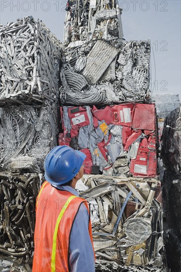 Worker at recycling plant.