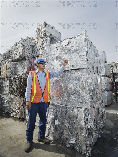 Worker at recycling plant.