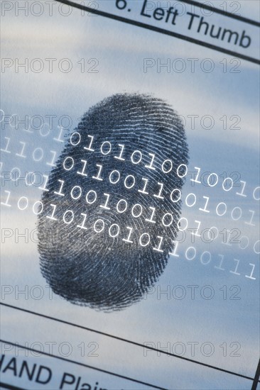 Computer code over thumbprint.