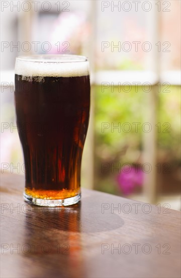 Glass of Irish ale in pub.