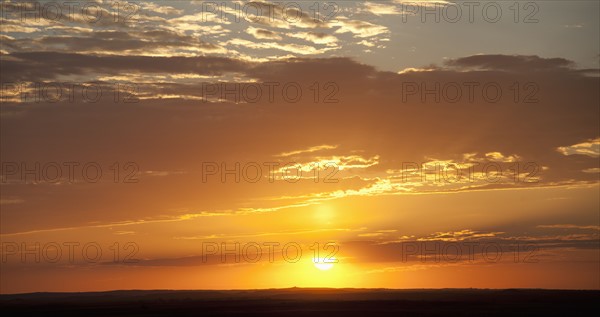 Sunset above prairie.