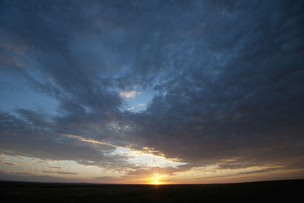 Sunset above prairie.