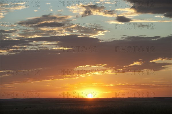 Sunset above prairie.