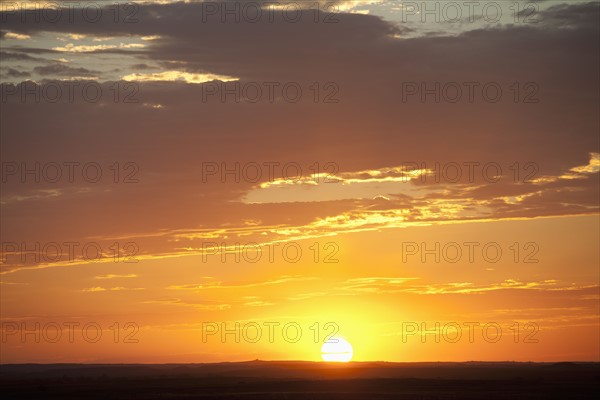 Sunset above prairie.