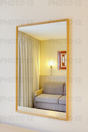 Sofa reflection in mirror of luxury home. Photo : Jon Boyes