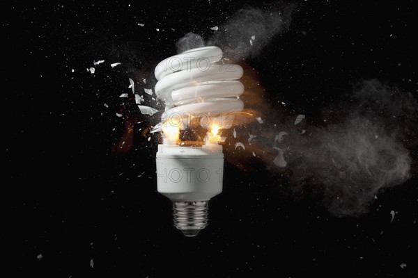 Energy efficient lightbulb exploding. Photo : Mike Kemp