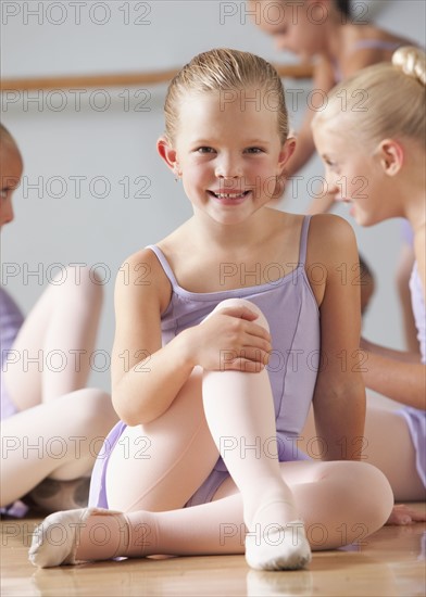 Portrait of female ballet dancer (6-8) in dance studio. Photo : Mike Kemp