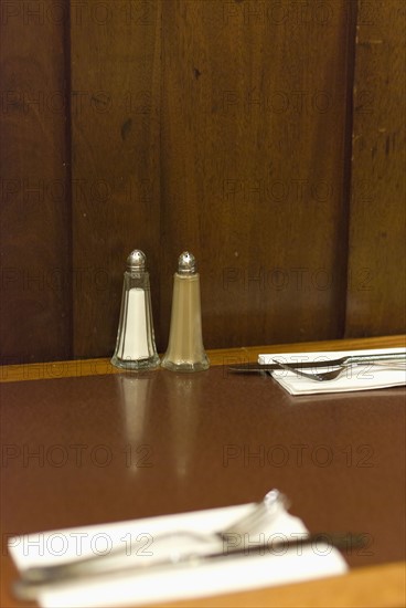 Salt and pepper condiments on cafe table. Photo : Antonio M. Rosario