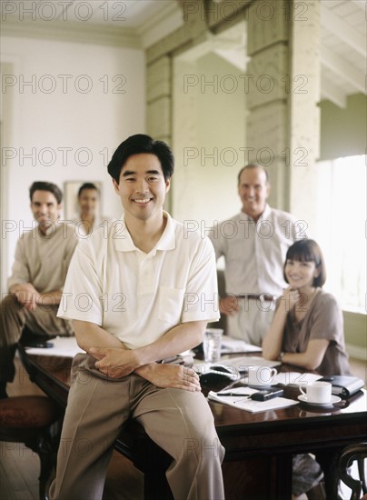 Colleagues in conference room. Photo : Fisher Litwin