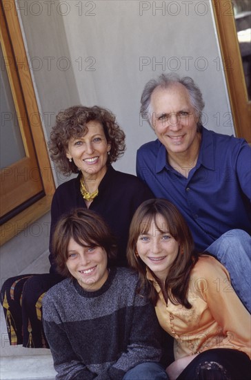 Family sitting on steps. Photo : Fisher Litwin