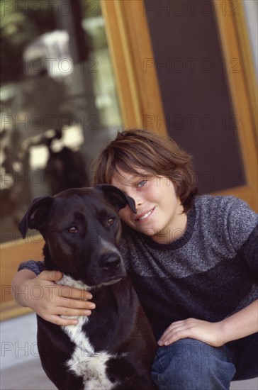 Young boy and his dog. Photo : Fisher Litwin