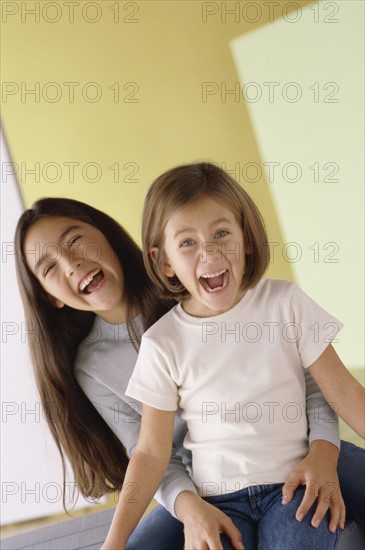 Sisters laughing. Photo : Fisher Litwin