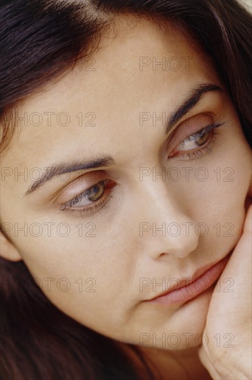 Worried woman. Photo : Fisher Litwin