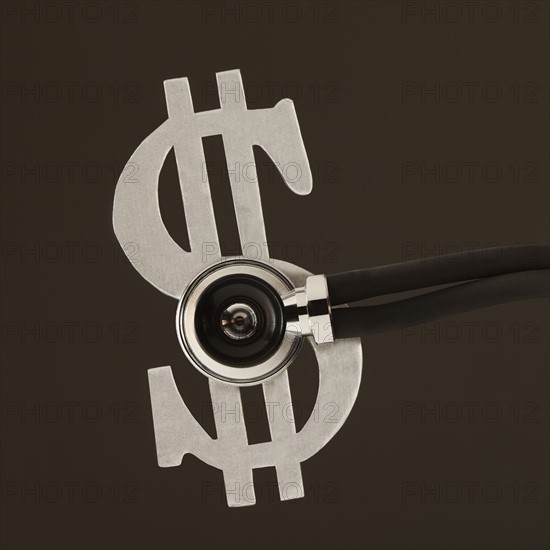 Stethoscope on "Dollar" sign. Photo : Mike Kemp