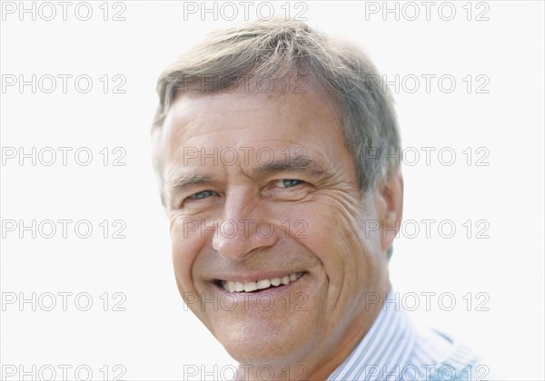 Portrait of smiling senior man. Photo : Momentimages