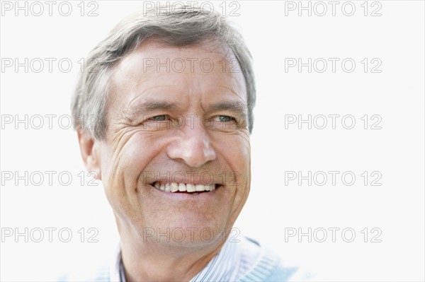 Portrait of smiling senior man. Photo : Momentimages